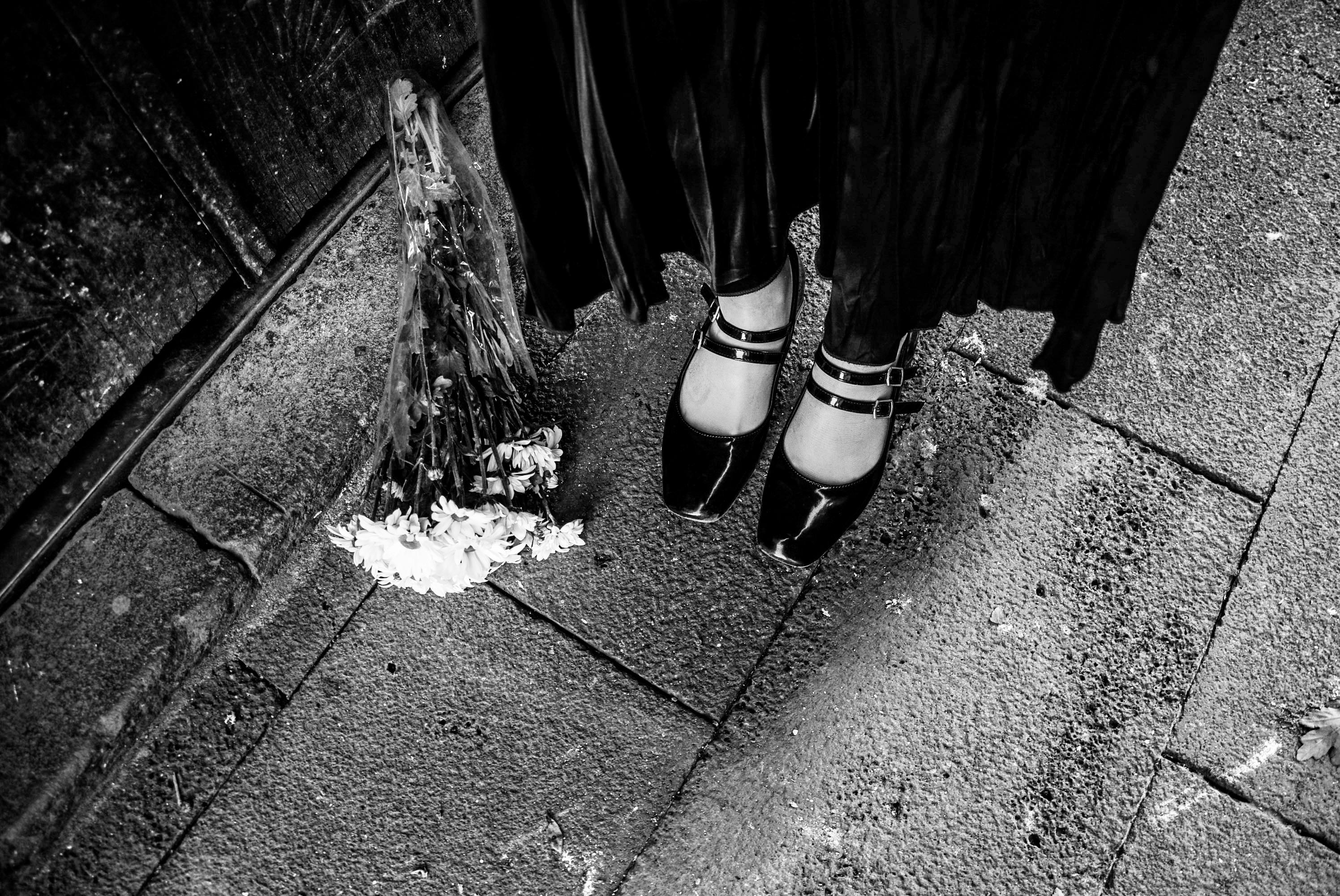 black and white artistic street scene with flowers