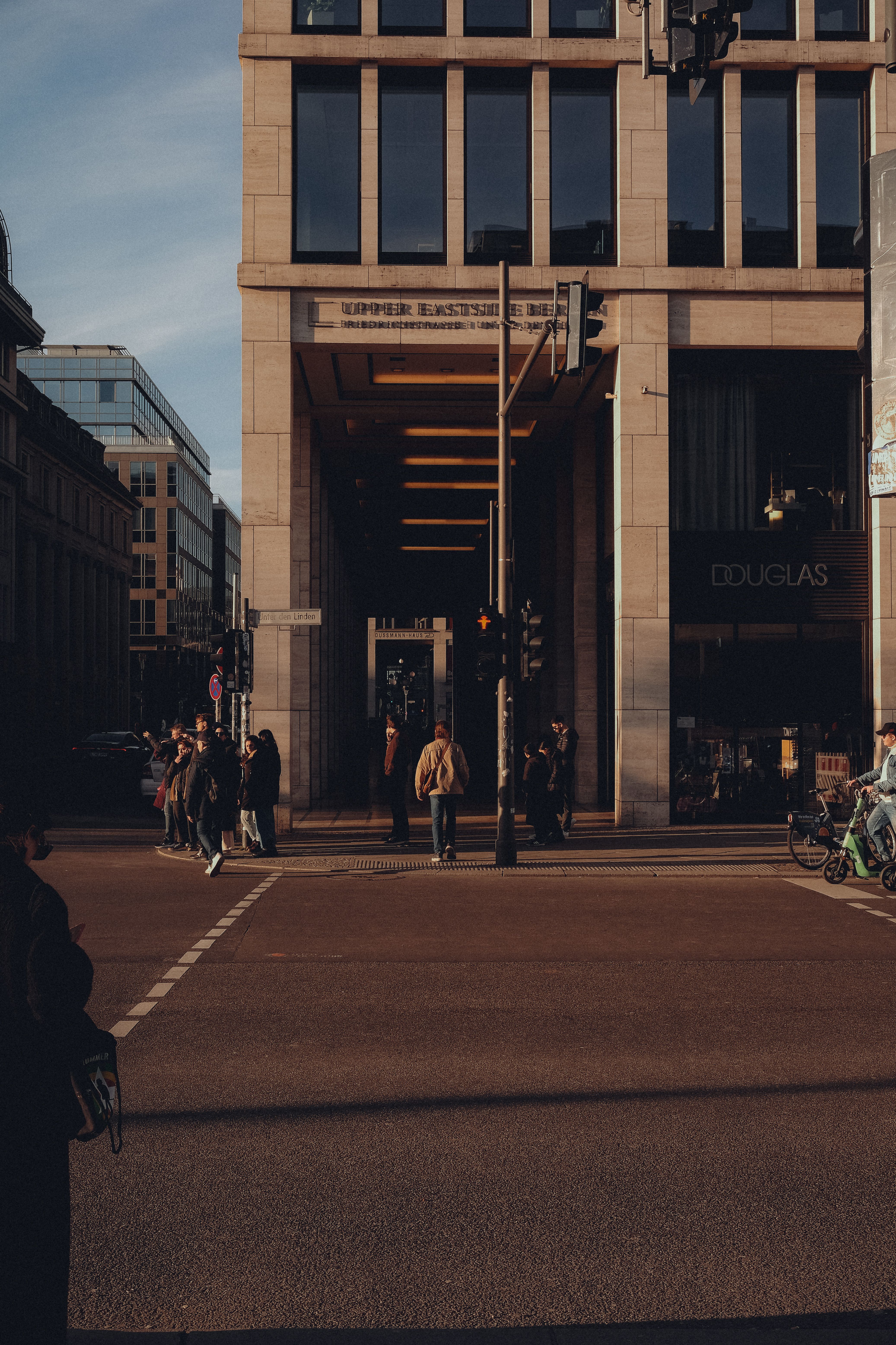 Bustling Urban Street with Pedestrians at Dusk · Free Stock Photo