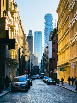 Dynamic street scene in New York City with skyscrapers and vibrant architecture.