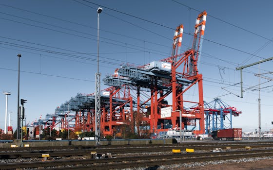 Dynamic view of cranes and shipping containers at Hamburg's bustling port.