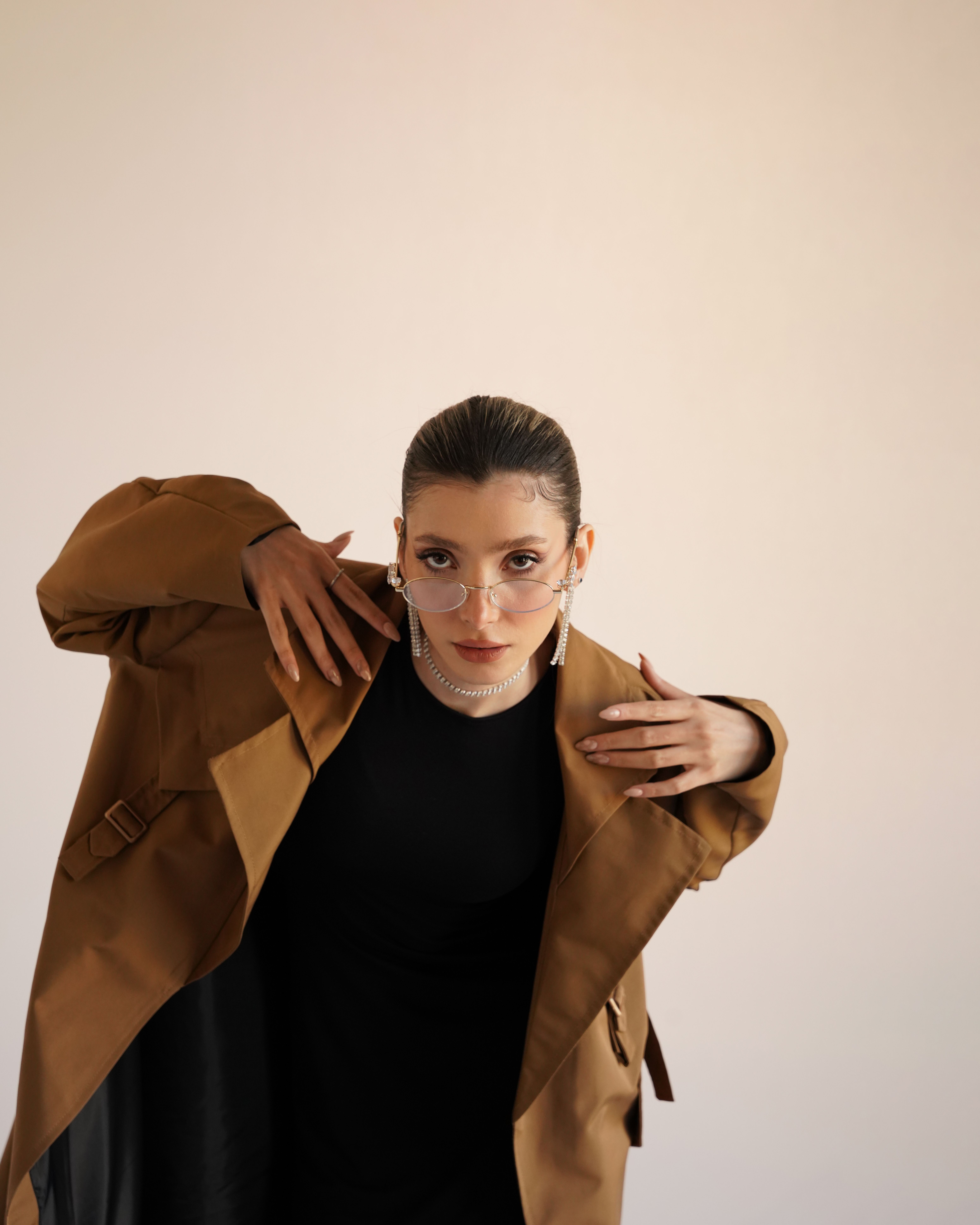 Stylish Woman in Brown Coat Posing for Portrait · Free Stock Photo