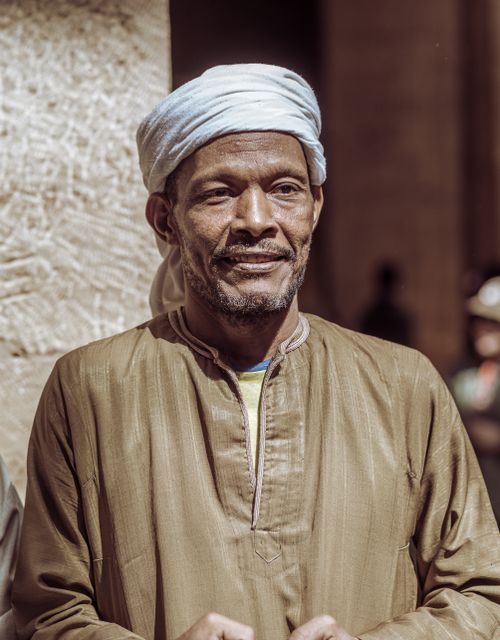 Free A Middle Eastern man wearing traditional clothing and turban stands confidently. Stock Photo