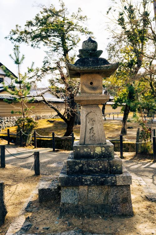 Free Classic stone lantern in a serene Japanese garden, capturing cultural heritage and natural beauty. Stock Photo