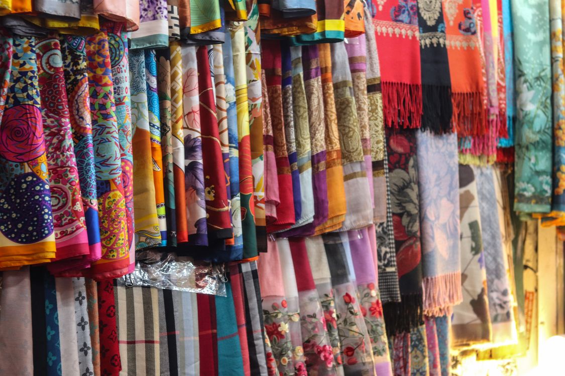 Shawls Collection Vibrant Assortment of Colorful Silk Shawls · Free Stock Photo