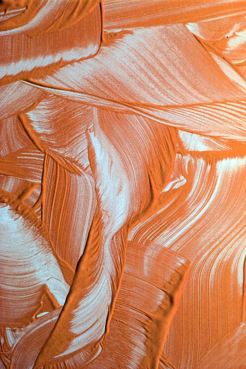 Free Closeup of a vibrant abstract orange texture created with dynamic brushstrokes. Stock Photo