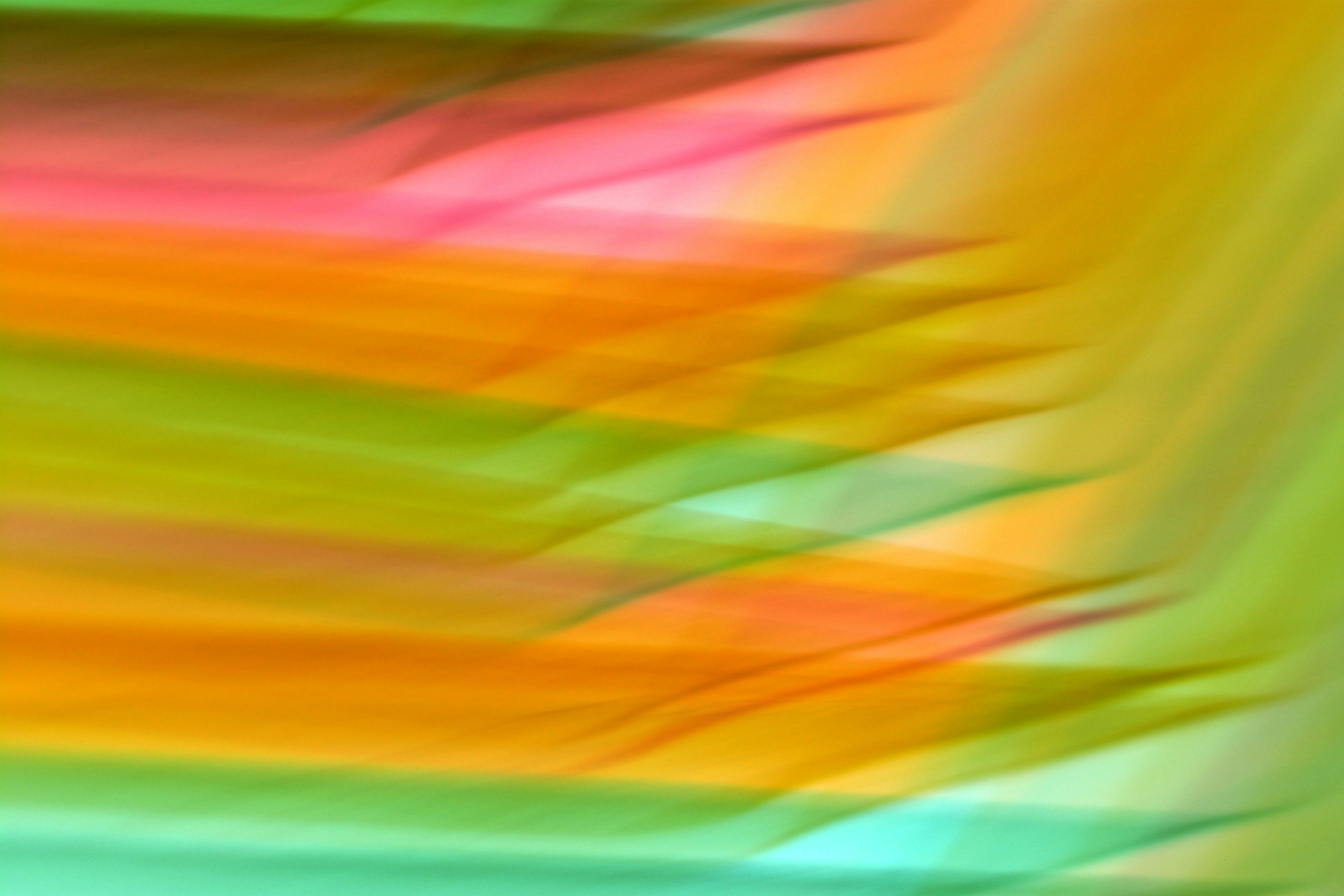 Free Abstract image featuring vibrant pink, orange, and green waves in a colorful pattern. Stock Photo