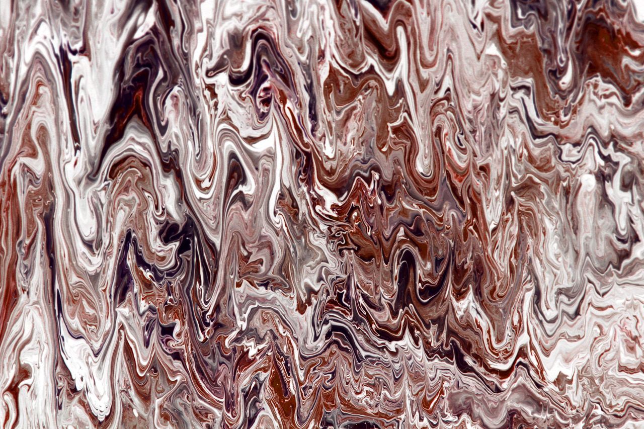abstract image featuring swirling brown and white marble like patterns
