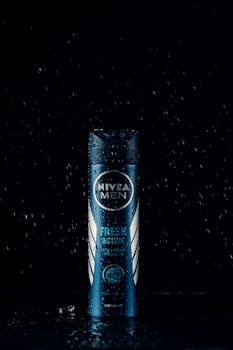 Nivea Men Fresh Active Deodorant under ambient lighting with water droplets, enhancing luxury.