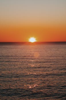 Stunning sunrise over the ocean in Florianópolis, Brasil. Perfect for tranquil moments.