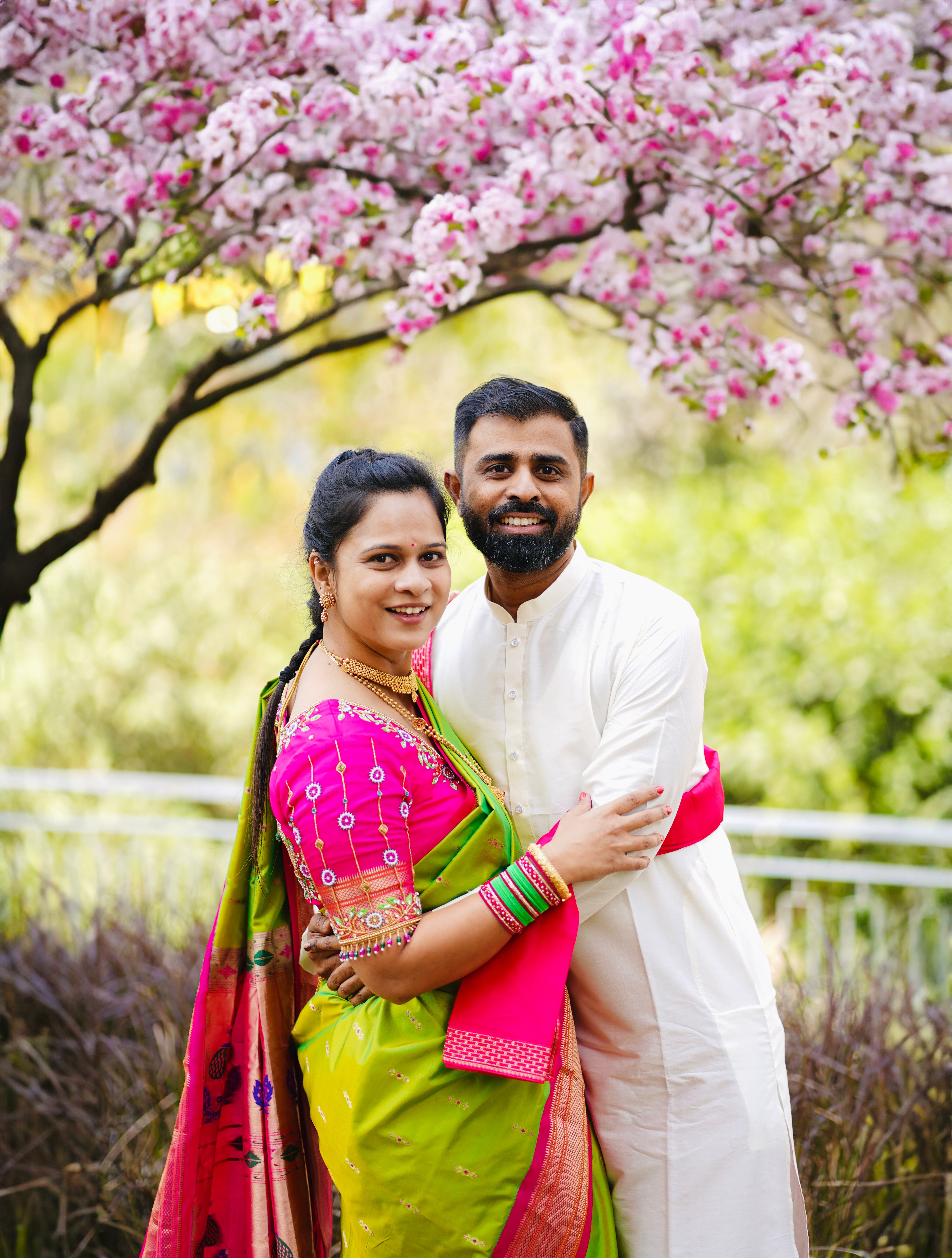 Happy Couple in Traditional Indian Attire Under Cherry Blossoms · Free ...