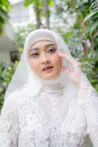 Muslim bride in white hijab