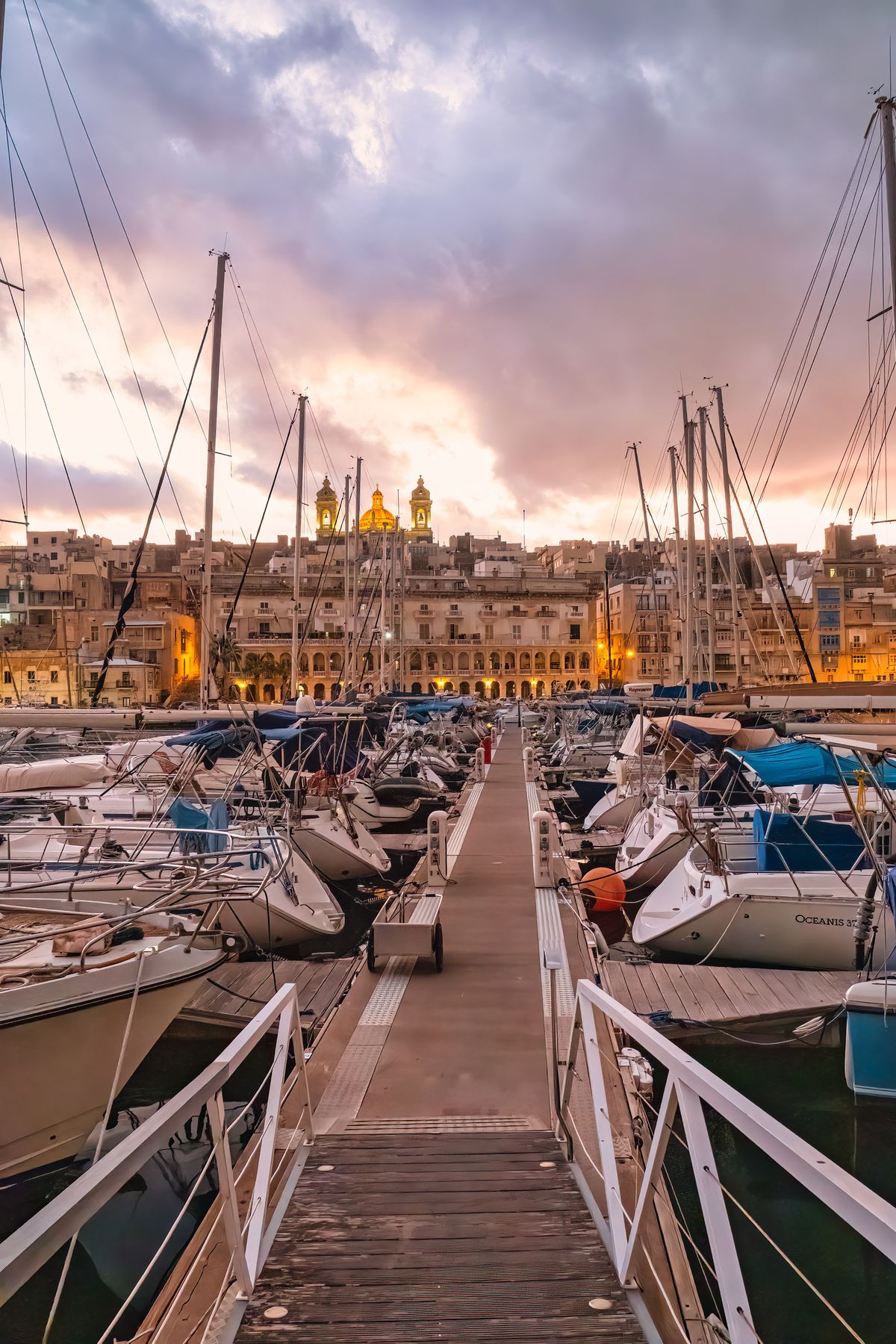 Yachts in a marina at sunset for a smooth summer social