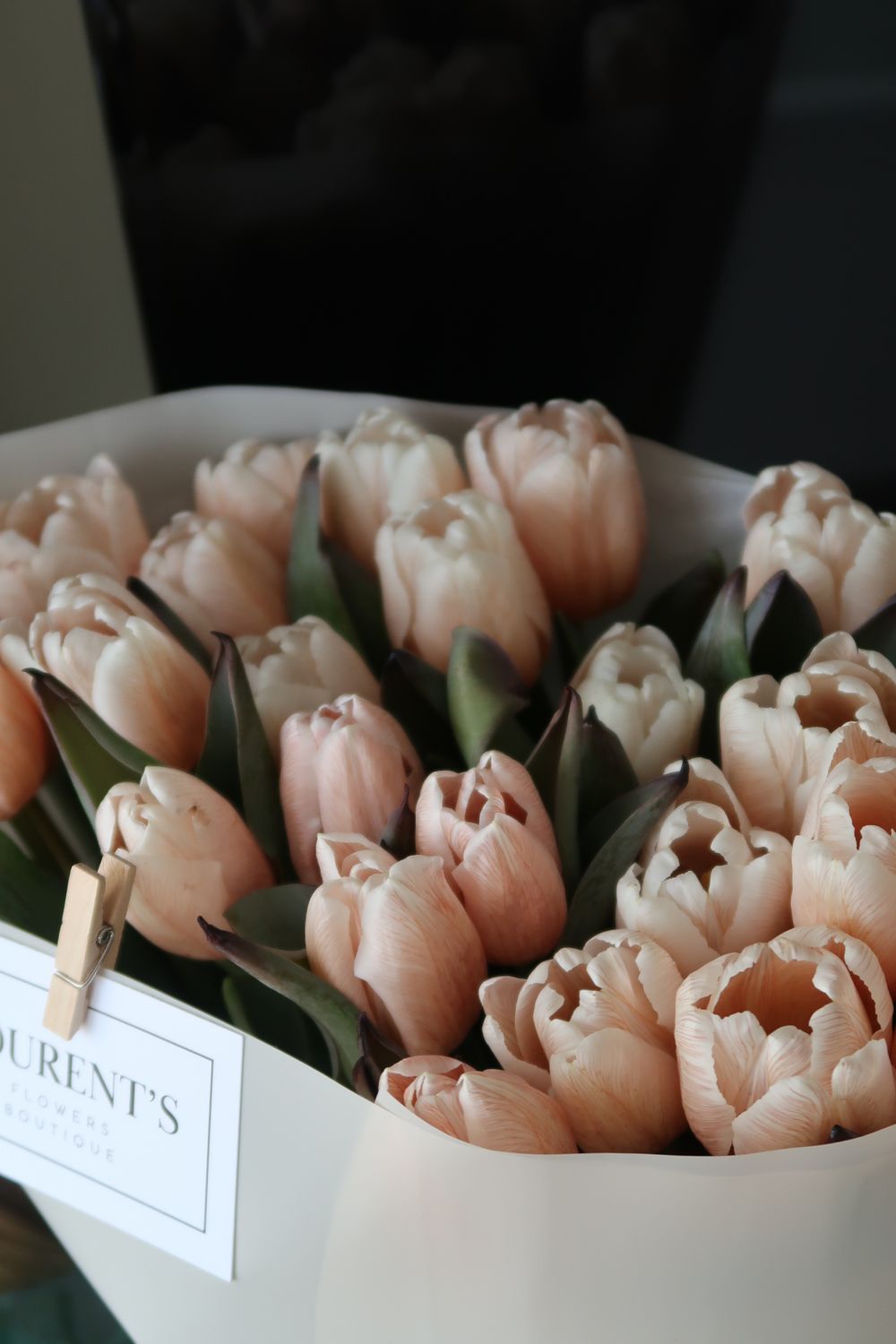 Pastel pink tulip bouquet for a graduation celebration