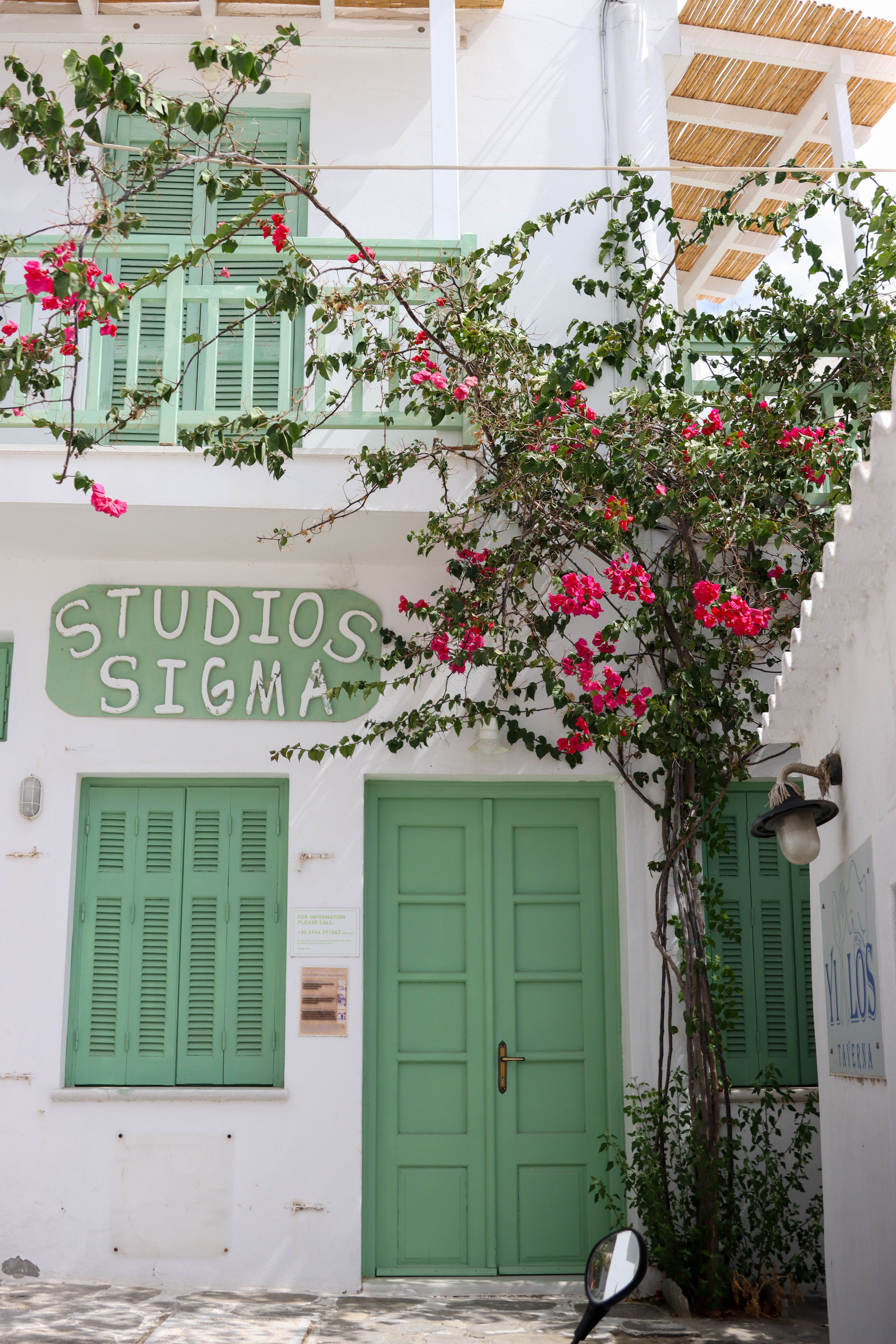 Traditional Greek architecture with vibrant bougainvillea in Naxos.