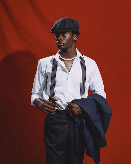 Elegant portrait of a man in Kumasi, Ghana, showcasing modern fashion and timeless style.