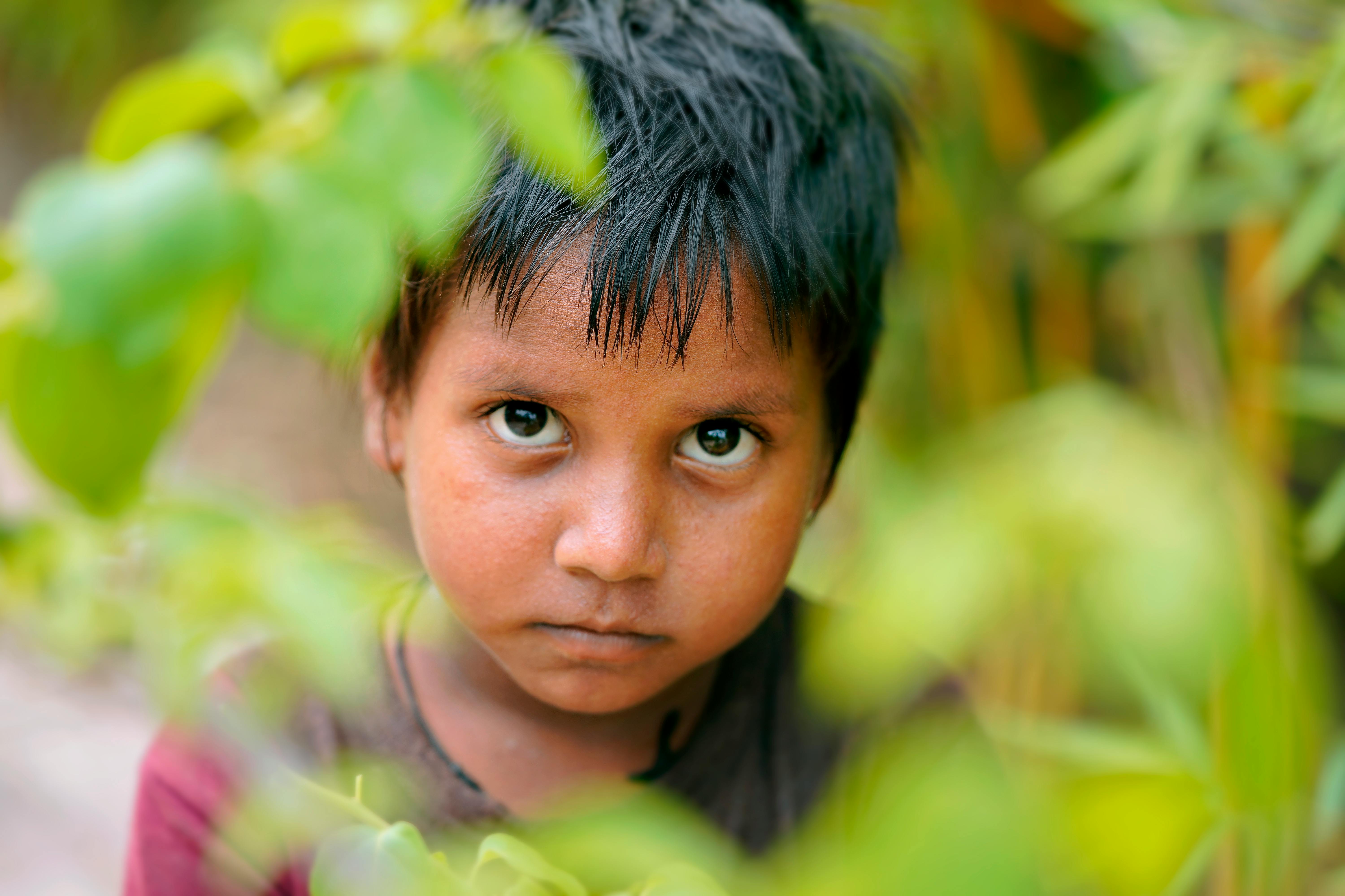Portrait of a Thoughtful Child Outdoors · Free Stock Photo