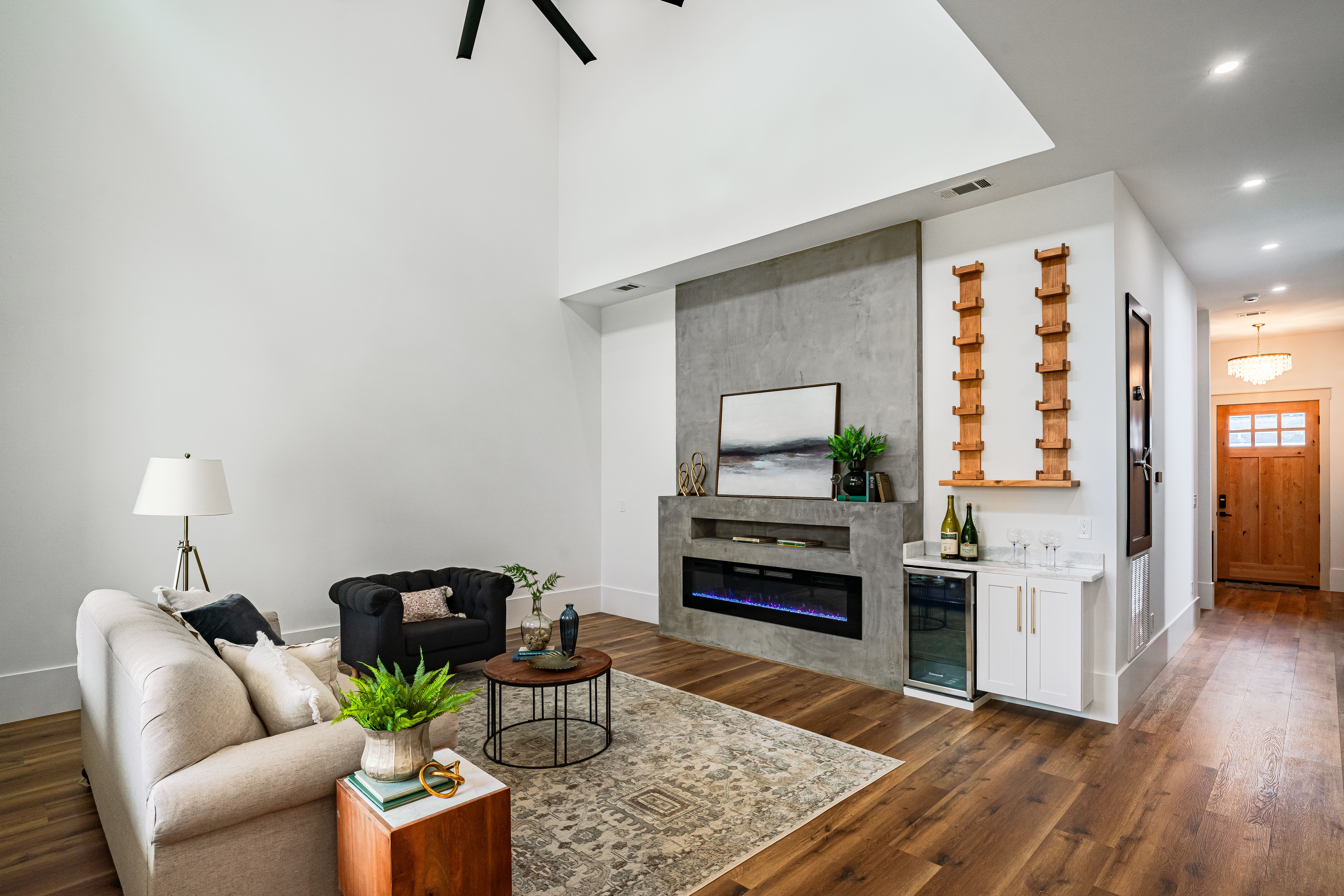 Chic living room with contemporary decor and fireplace in New Orleans home.
