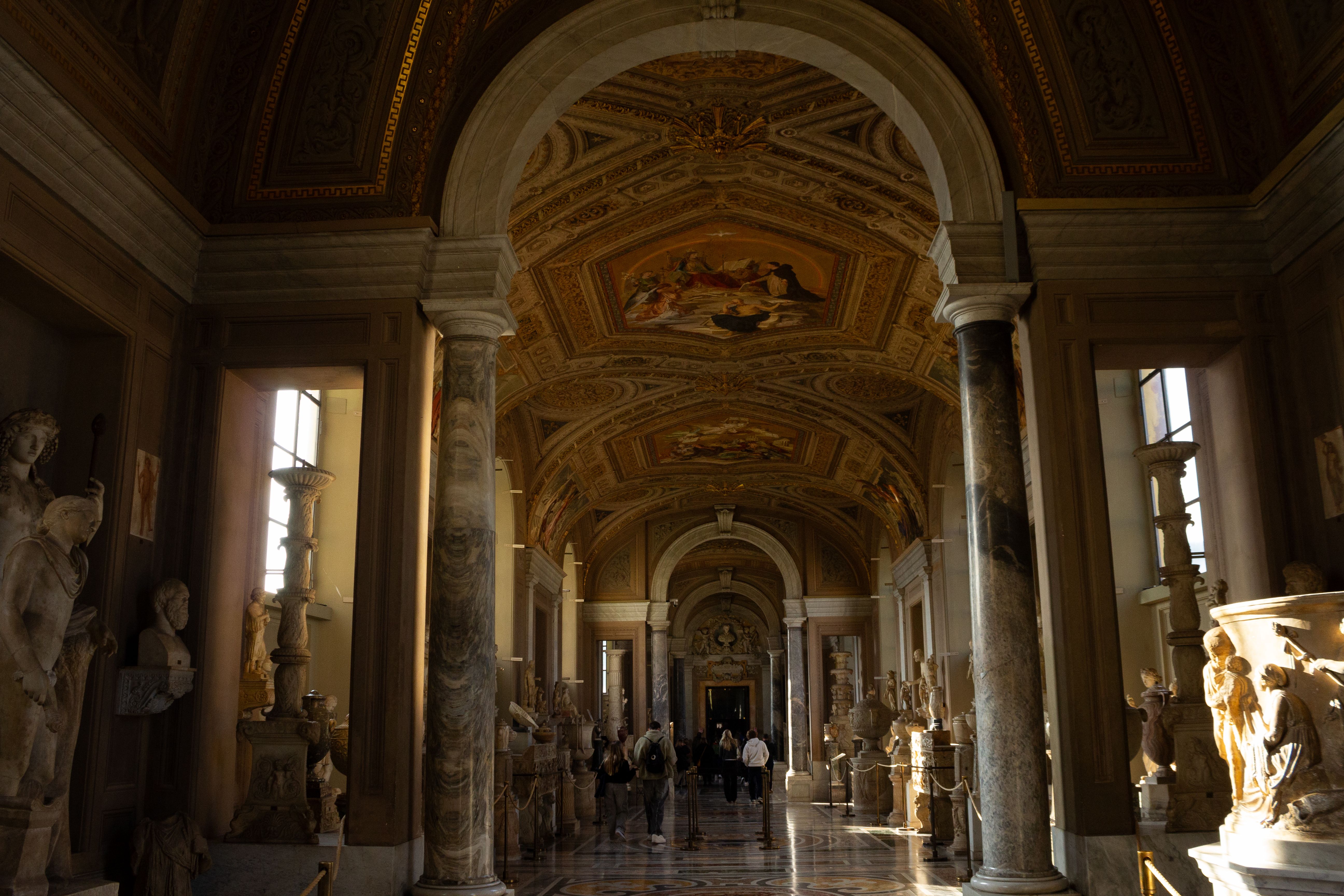 Tourists admiring sculptures inside the Borghese Gallery in Rome