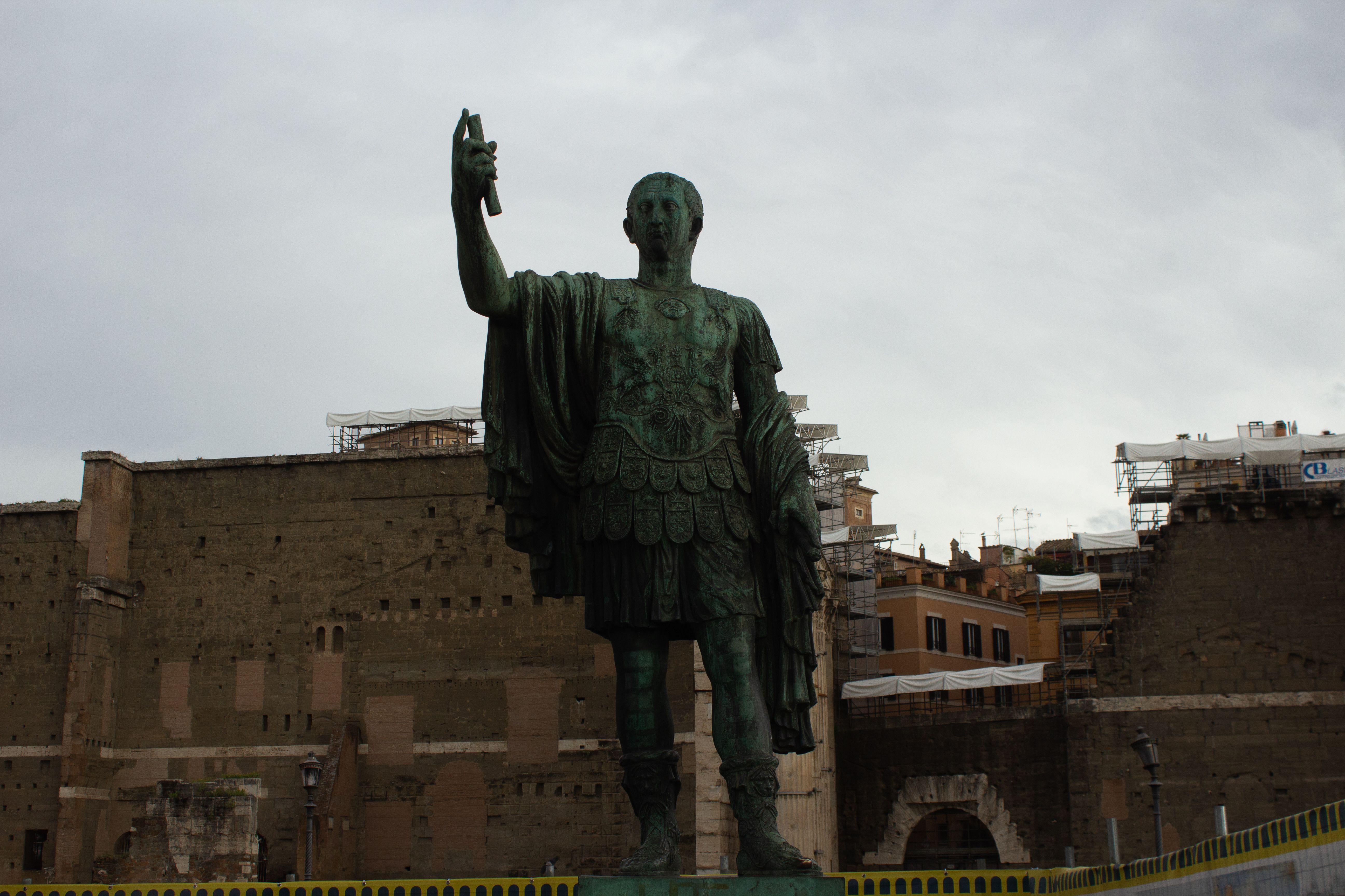 Dramatic statue of a Roman emperor situated in ancient Rome, Italy.