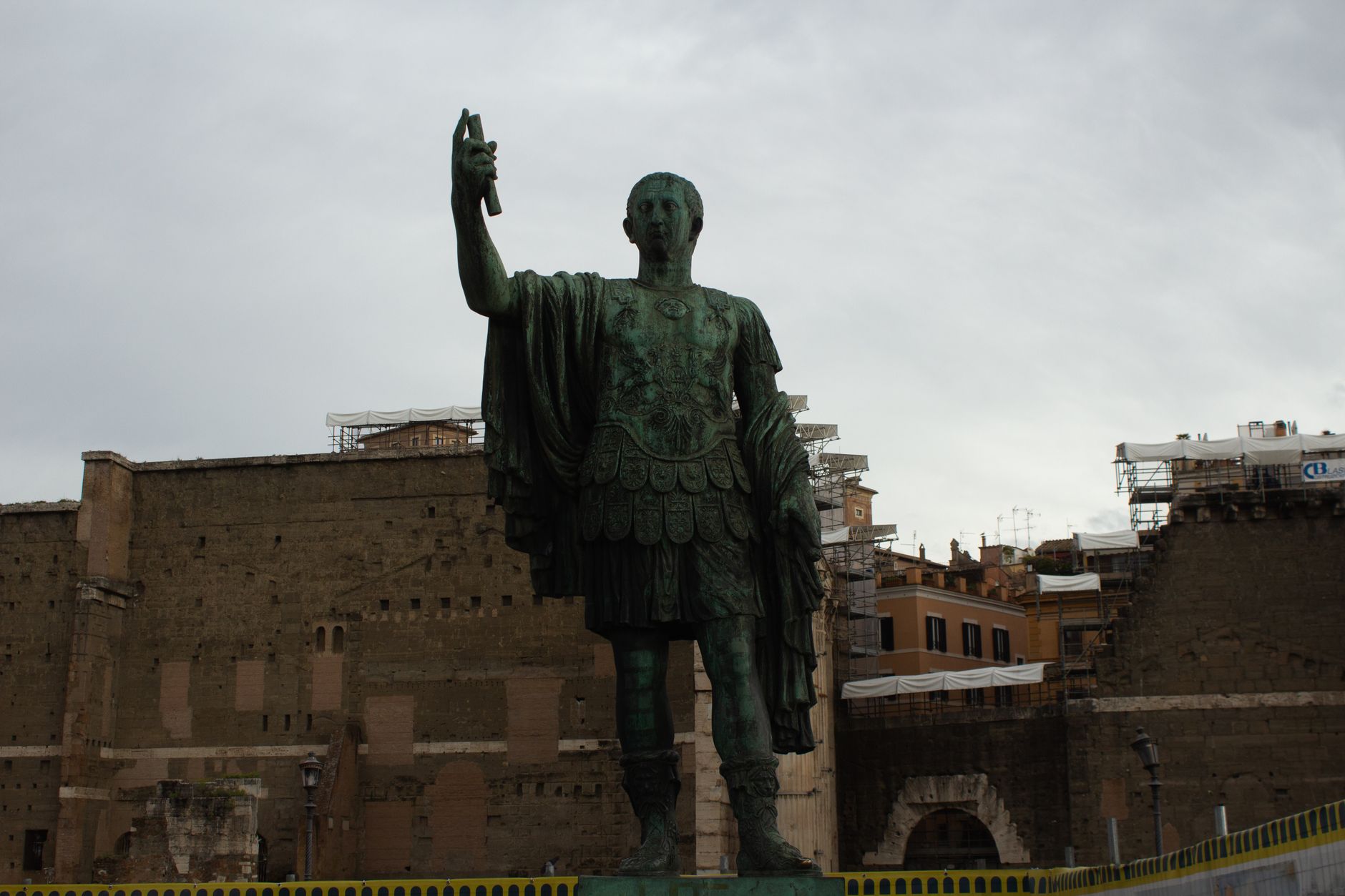 Dramatic statue of a Roman emperor situated in ancient Rome, Italy.