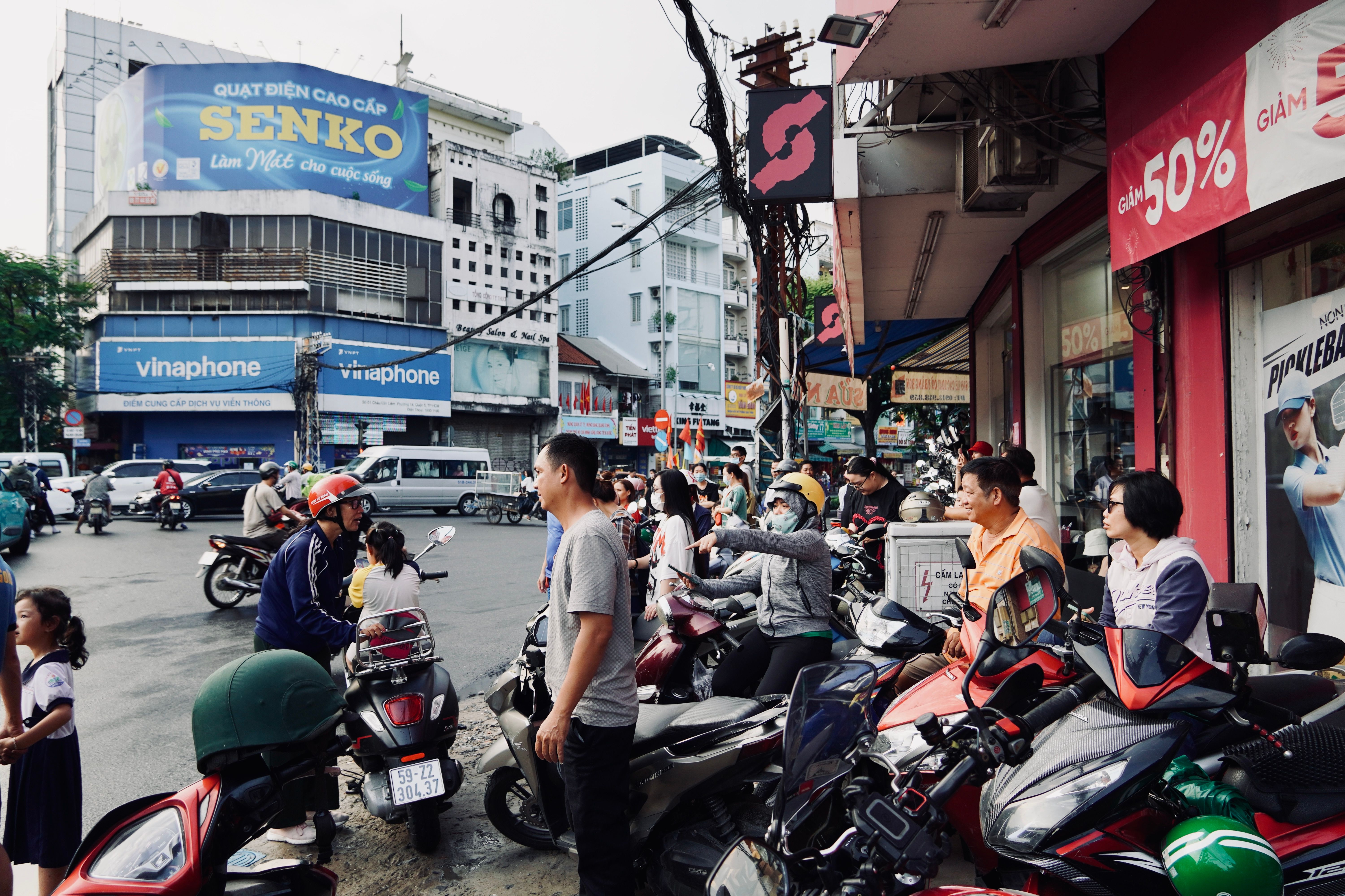 Lively street scene with people on motorbikes in Vietnam.