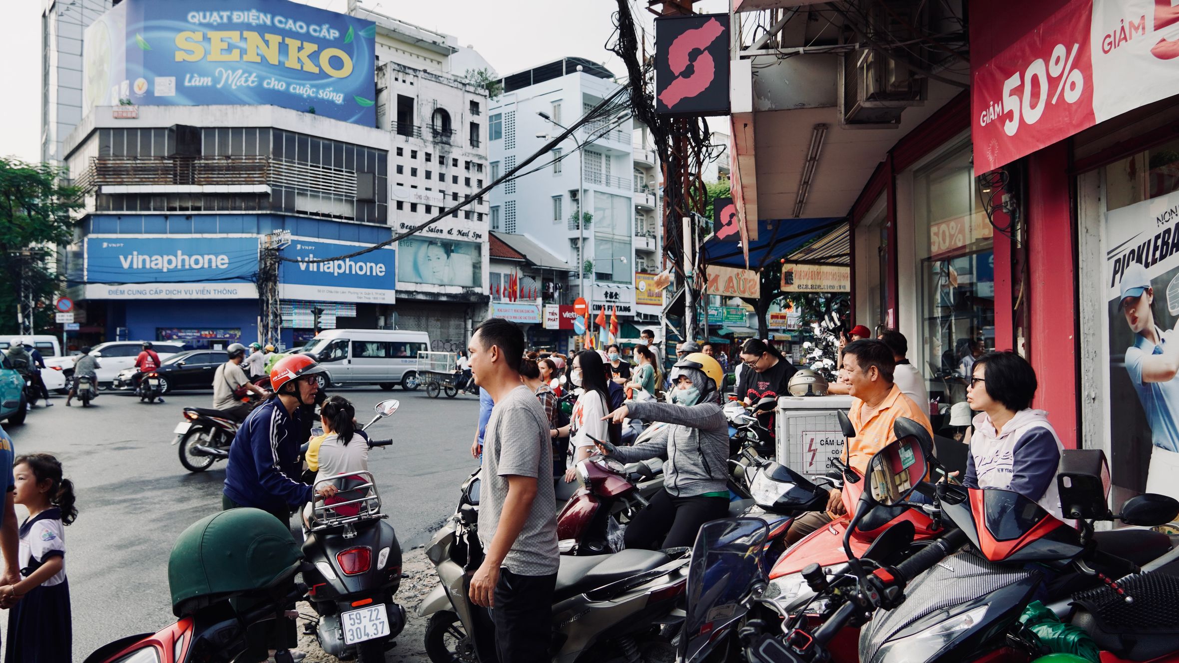 Lively street scene with people on motorbikes in Vietnam.