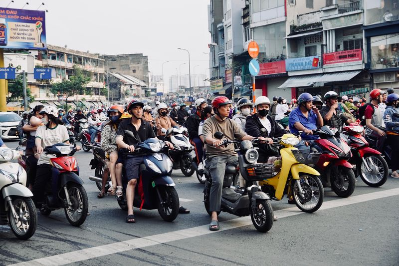 Dense motorbike traffic at a Southeast Asian intersection