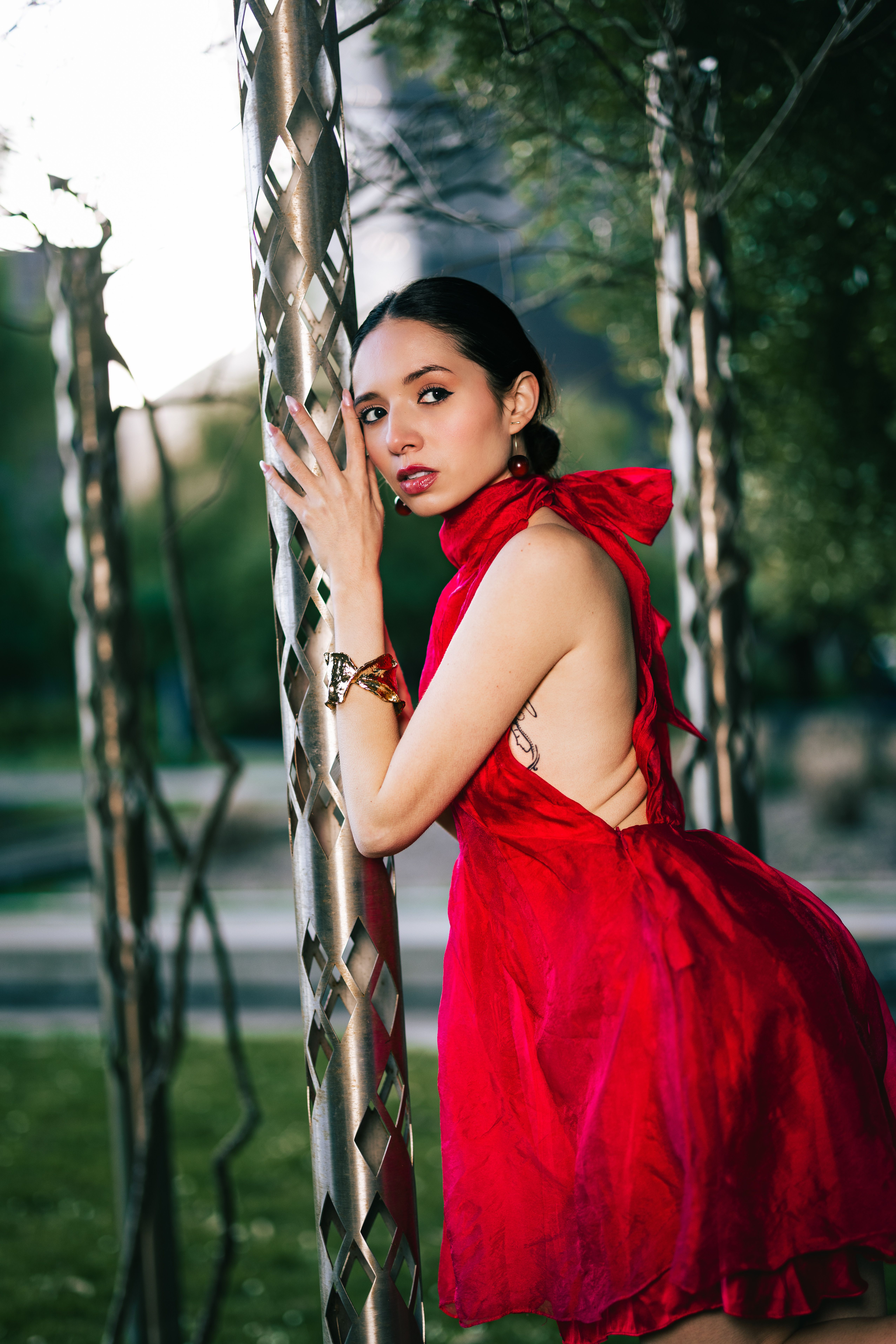Elegant Woman in a Vibrant Red Dress Outdoors · Free Stock Photo