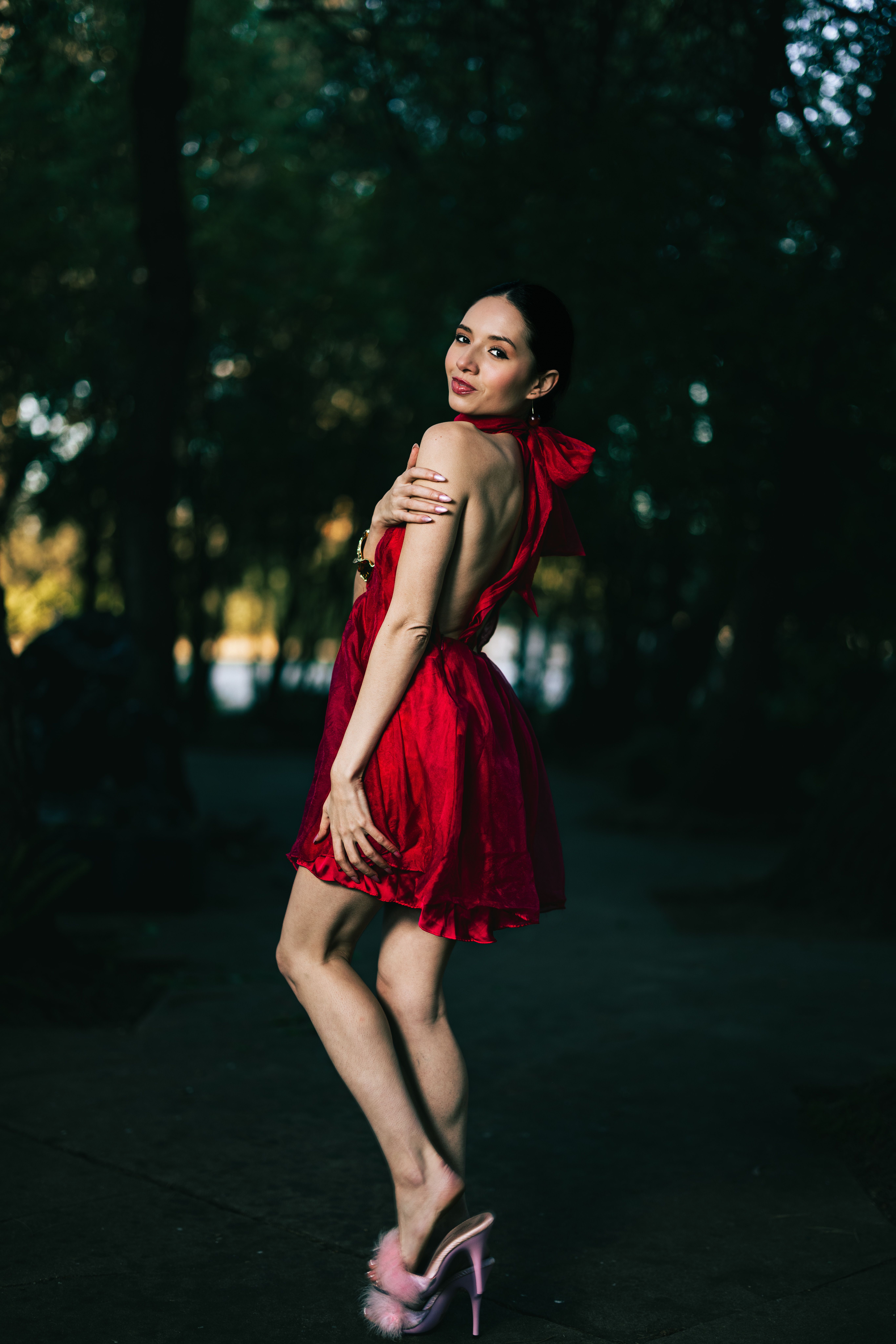 Elegant Woman in Red Dress Posing Outdoors · Free Stock Photo