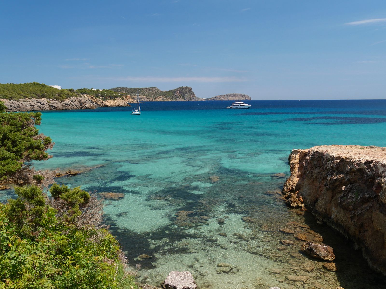 The luxury travel edit of Ibiza — scenic Cala Nova coastline at golden hour