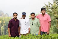 Group of Friends in a Lush Tea Plantation