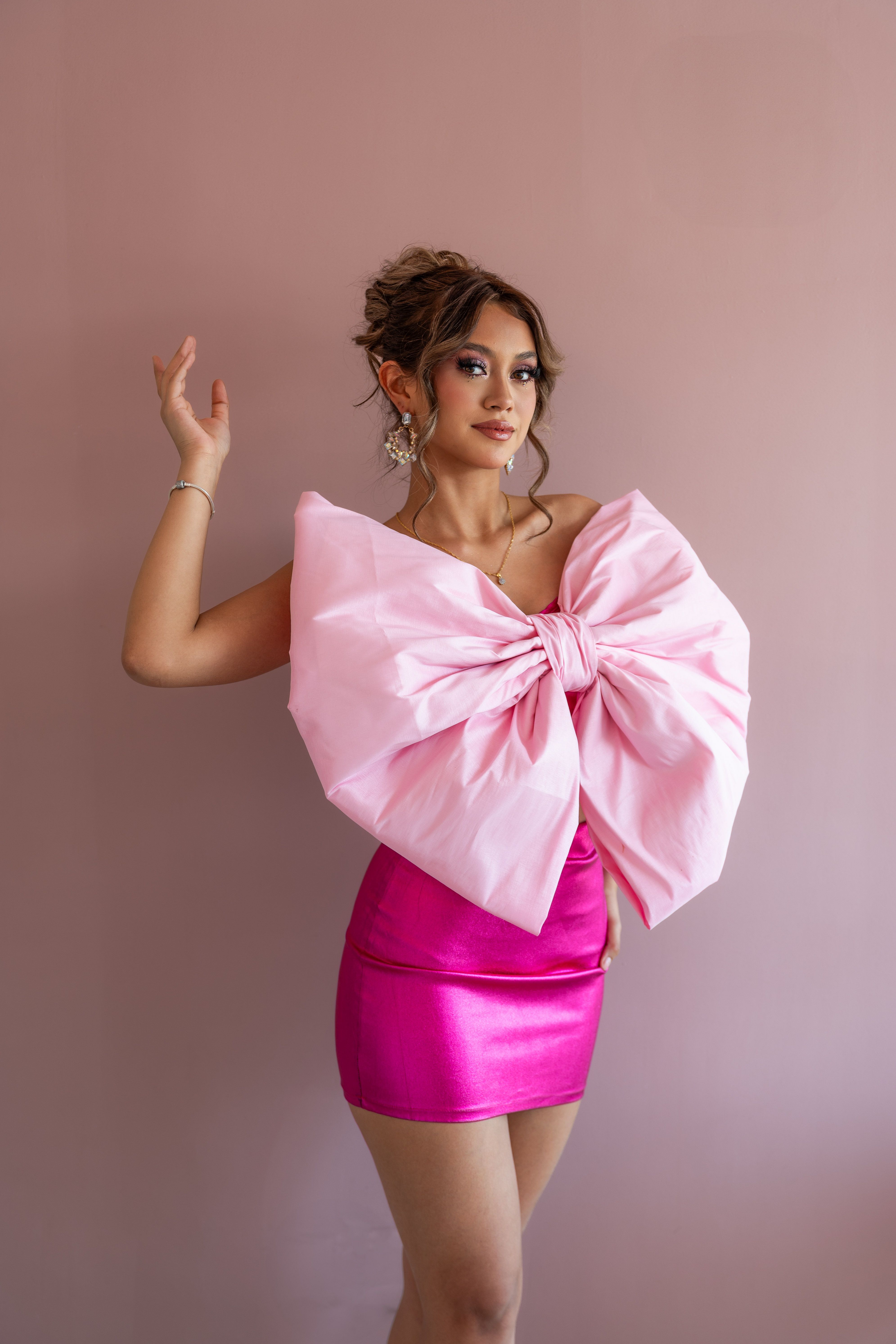 Stylish Woman in Bold Pink Bow Dress · Free Stock Photo — free download