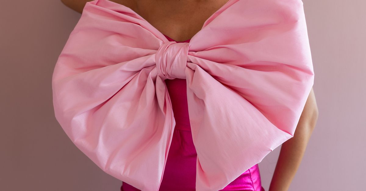 Elegant Woman In Pink Dress With Bow Free Stock Photo elegant-woman-in-pink-dress-with-bow-free-stock-photo