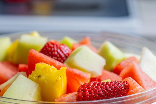 Free Close-up shot of a colorful fruit salad featuring strawberries, watermelon, and pineapple. Stock Photo