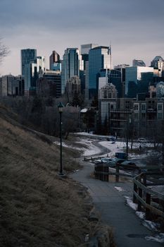 A scenic winter view of a pathway leading to downtown Calgary, Alberta, Canada skyscrapers.