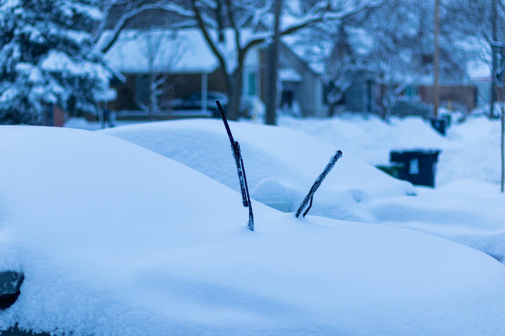 A car completely covered in snow