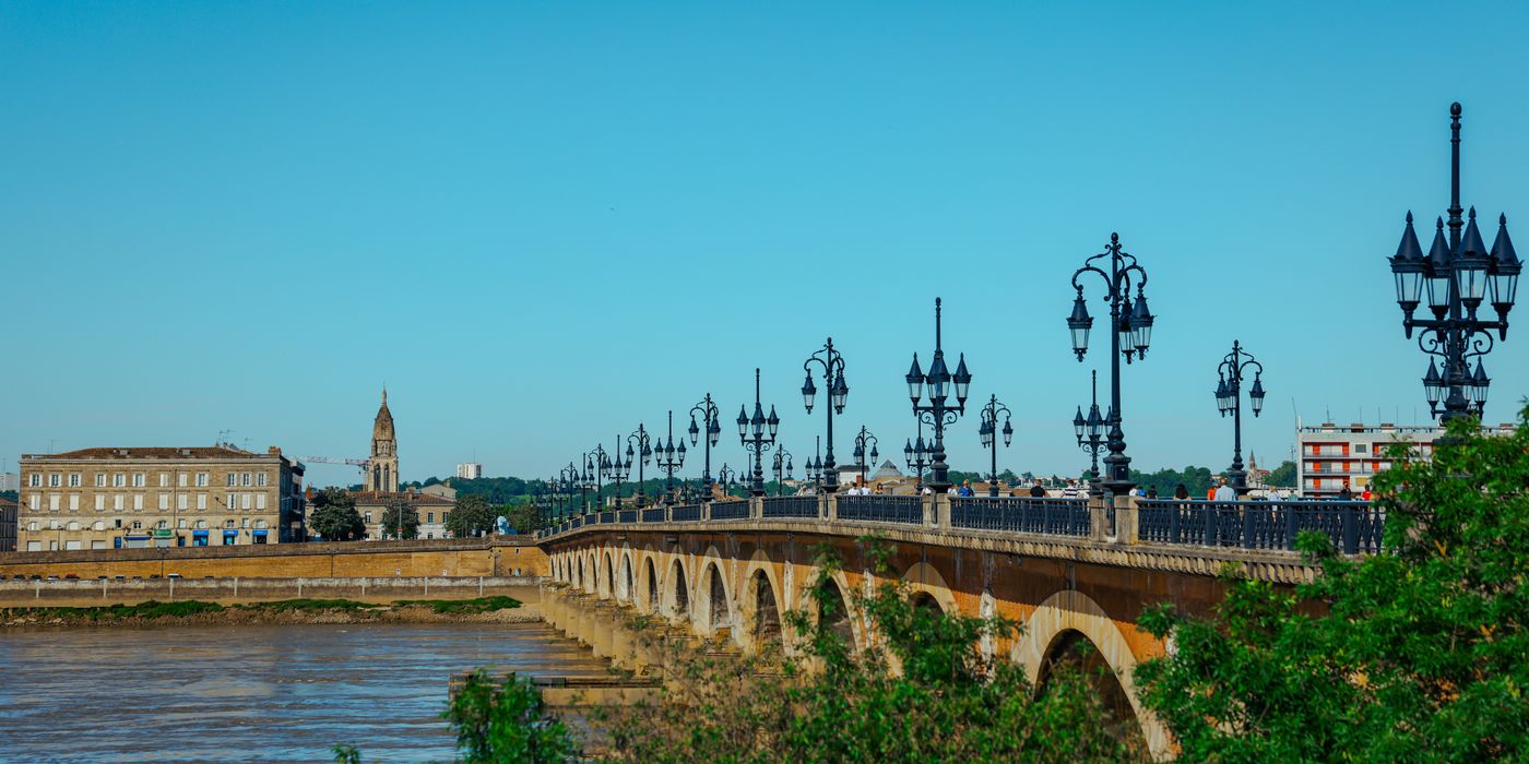Pont de Pierre bridge over the Garonne river in Bordeaux France on a sunny day