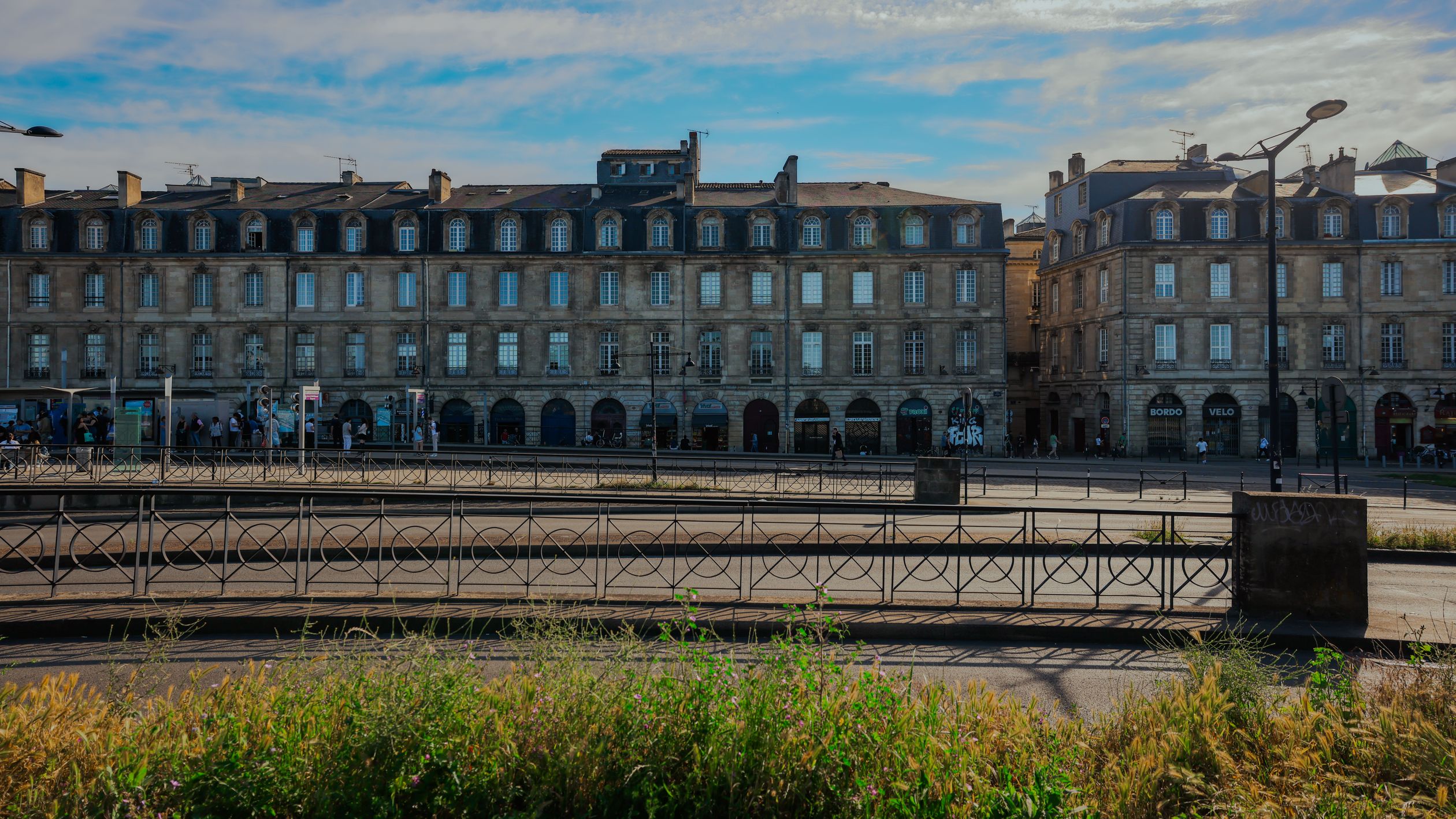 Elegant historic buildings in Bordeaux, France under a clear blue sky