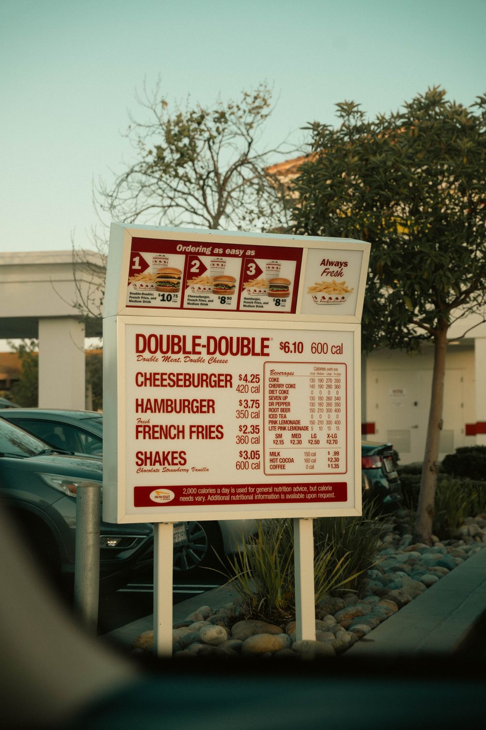 Restaurant drive-through order board and vehicle lane