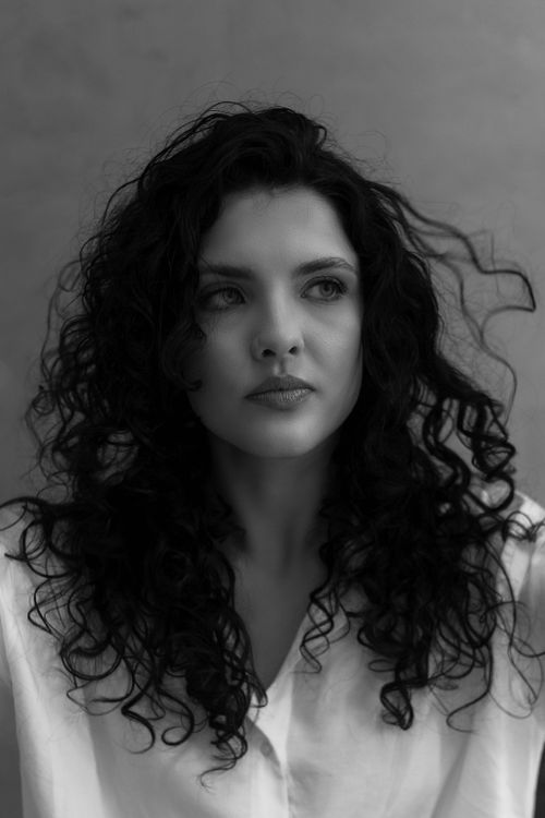 Portrait of Woman with Curly Hair in Black and White · Free Stock Photo