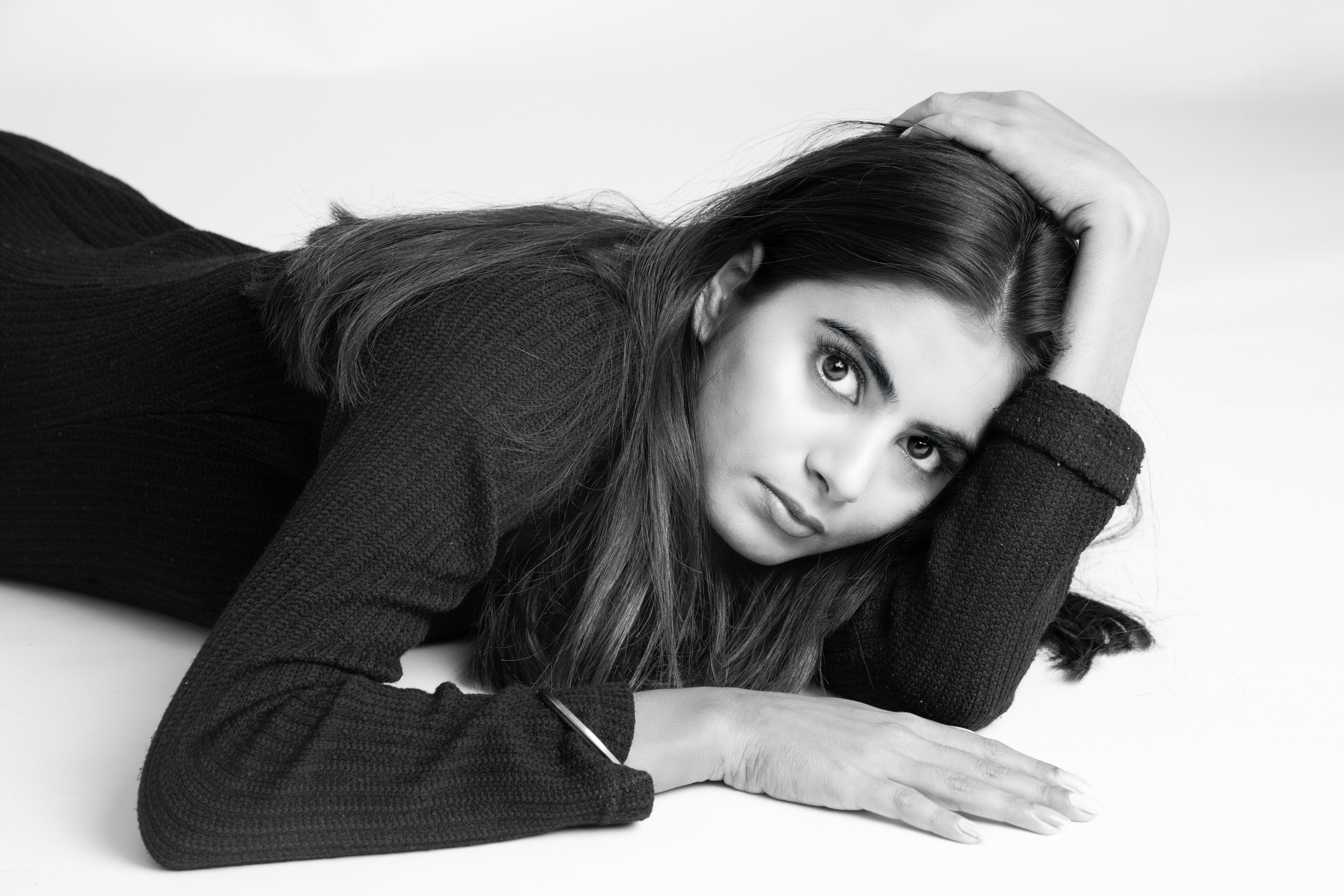 Black and White Portrait of a Woman Lying Down · Free Stock Photo