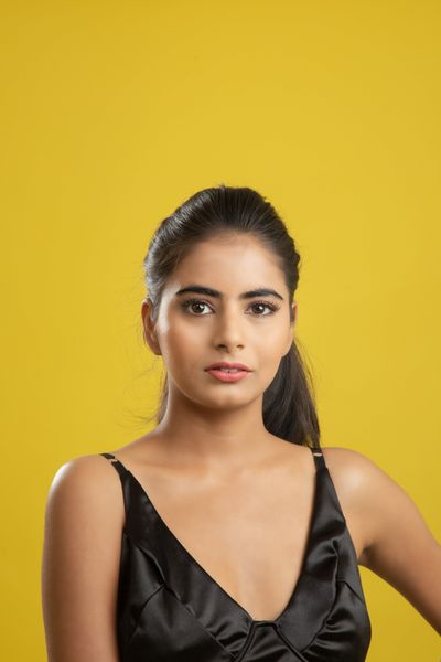 Studio portrait on a yellow backdrop by Anil Sharma on Pexels