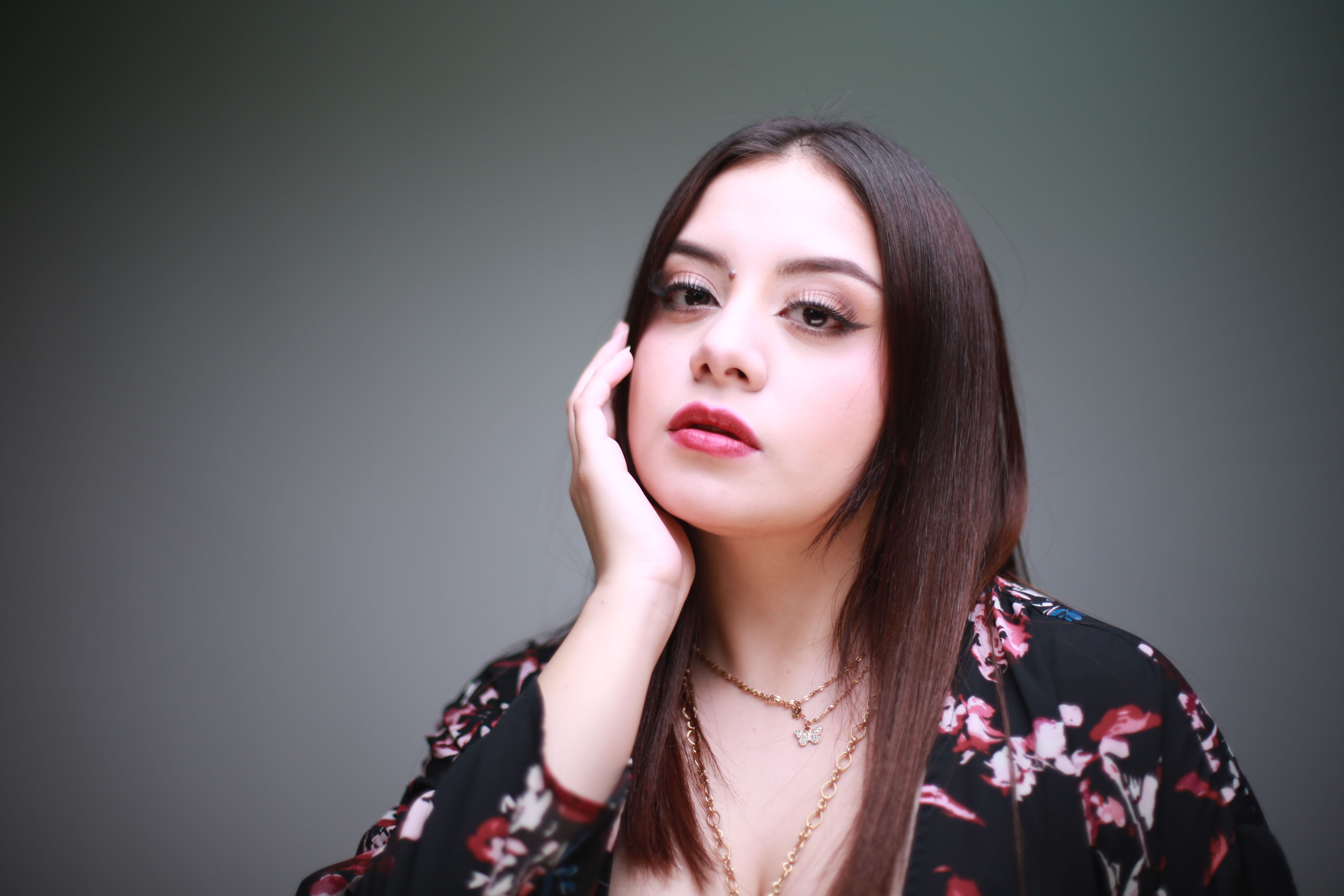 Elegant Portrait of Woman in Floral Attire · Free Stock Photo