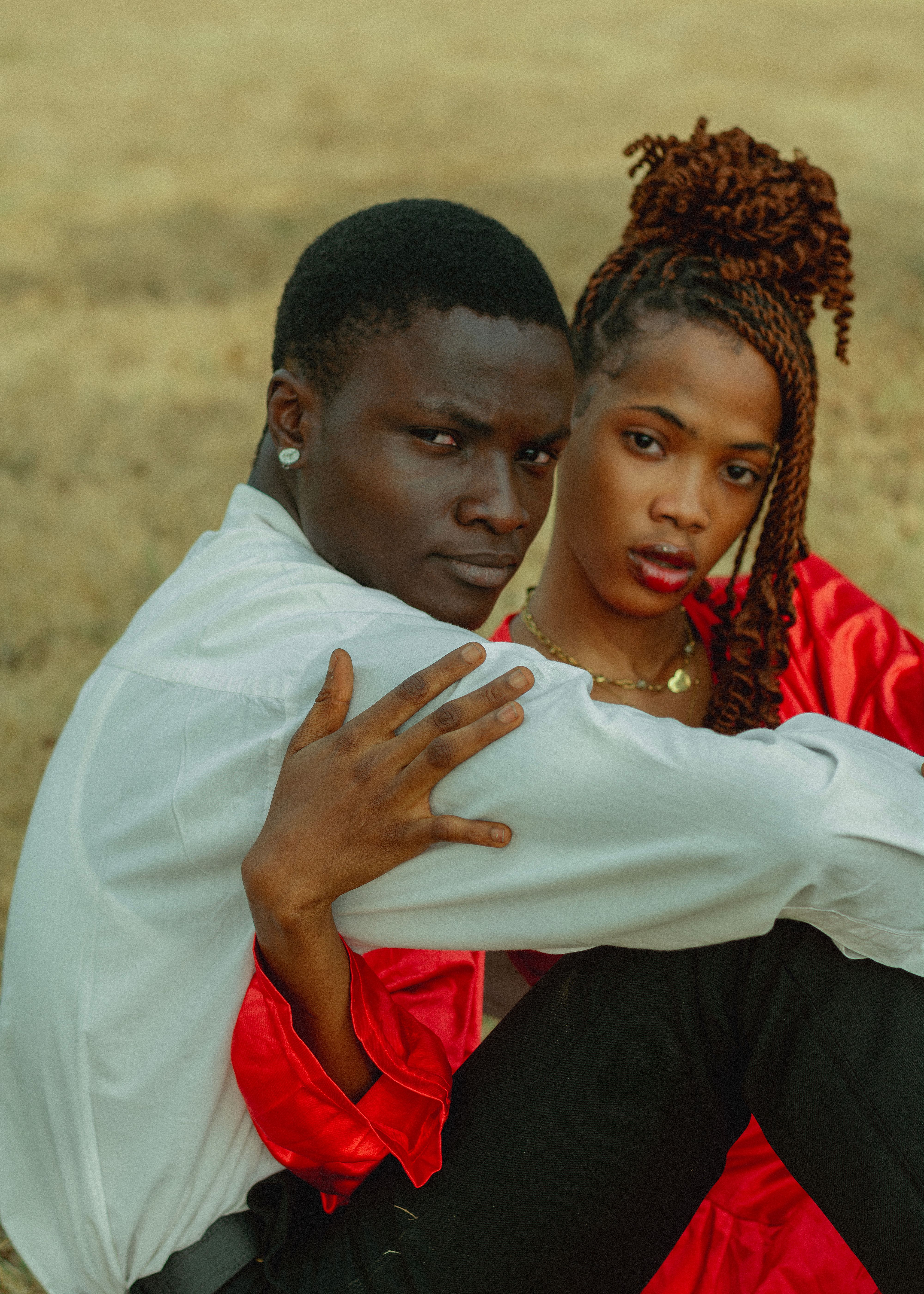 Romantic African Couple in Red and White Outdoors · Free Stock Photo