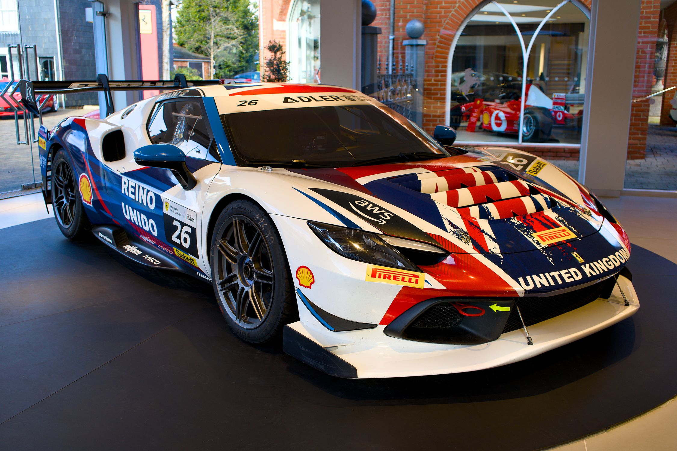 Union Jack Racing Race Car with Union Jack Theme on Display Indoors · Free Stock Photo