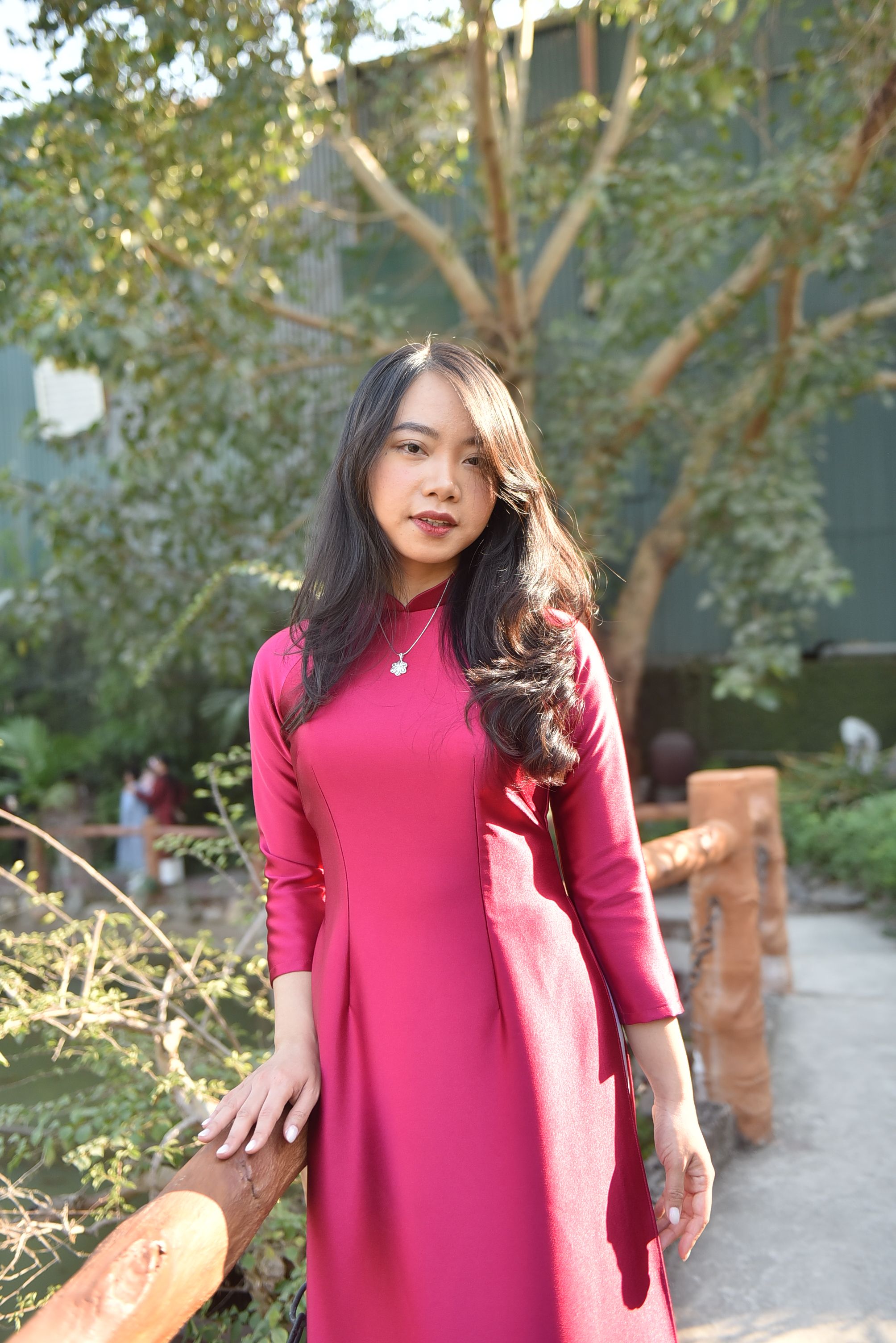 Young Woman in Pink Dress Outdoors in Sunlight · Free Stock Photo