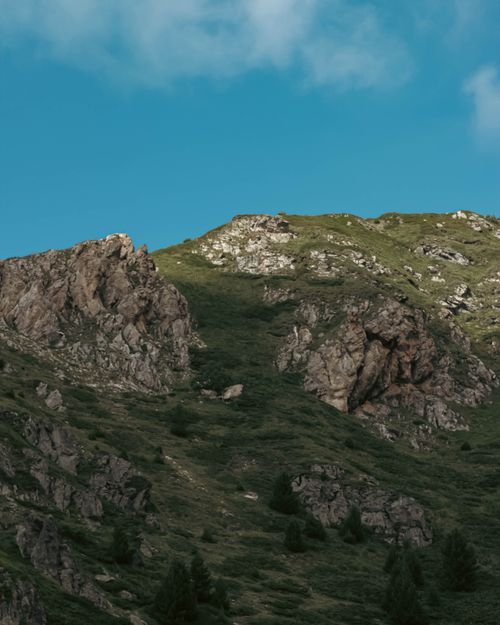 Free Stunning summer view of a rocky mountain landscape under a blue sky. Stock Photo