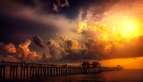 Free Boardwalk in Ocean during Golden Hour Stock Photo