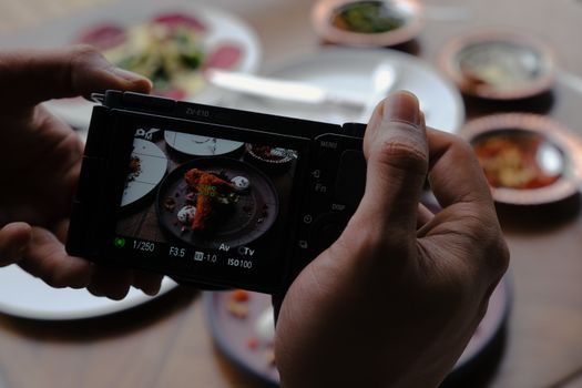 A close-up of a camera capturing a gourmet dish in Istanbul.
