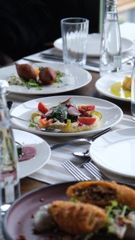 A sophisticated dining table with various gourmet dishes elegantly presented.